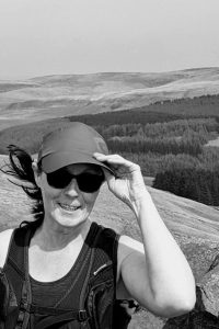 Helen's Story: Living with a acoustic Neuroma. Picture of Helen on top of dales.