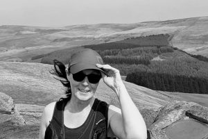 Helen's Story: Living with a acoustic Neuroma. Picture of Helen on top of dales.