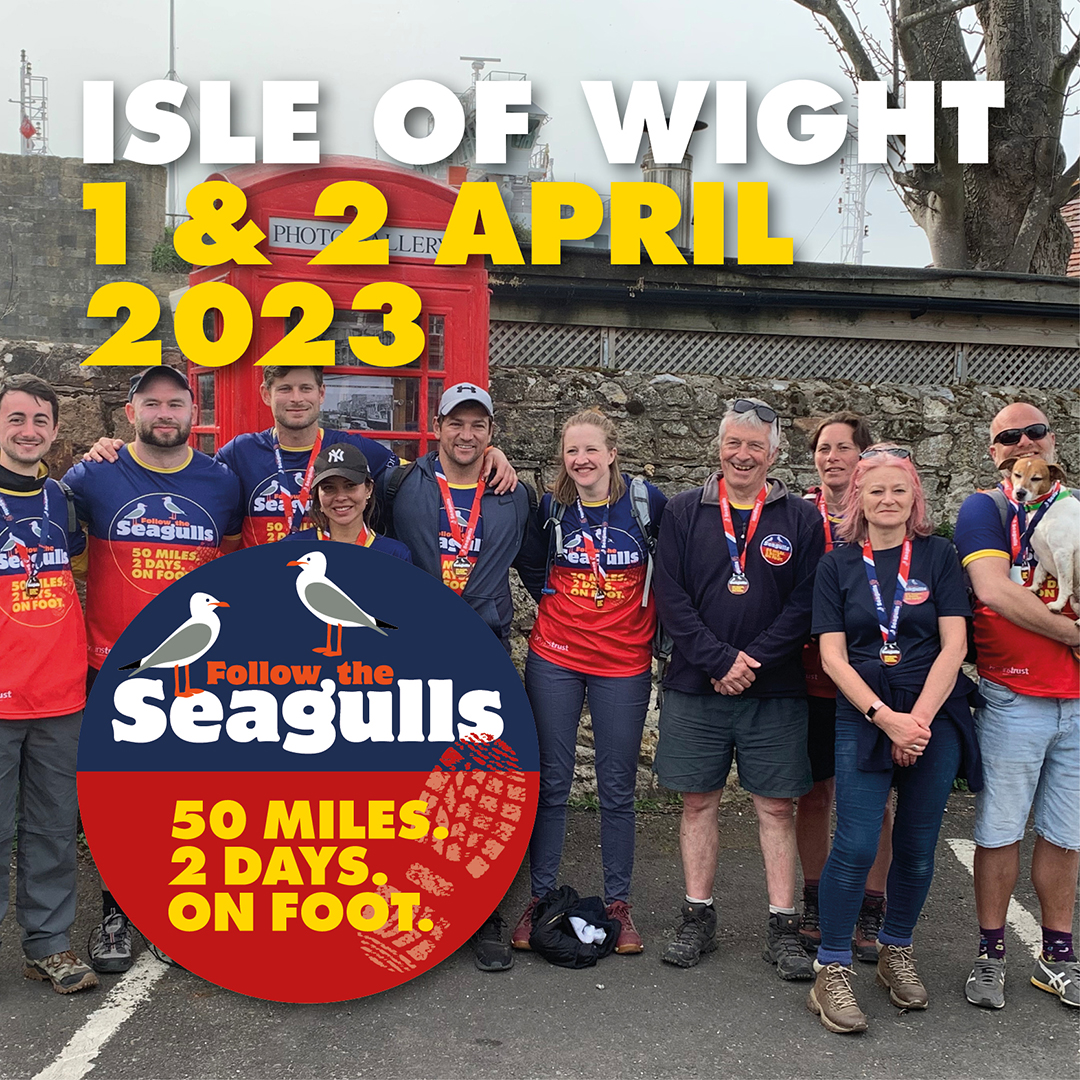 Text reads: Isle of Wight. 1 and 2 April. ID: group of charity walkers wearing the Follow the Seagulls tshirts smiling arm in arm.