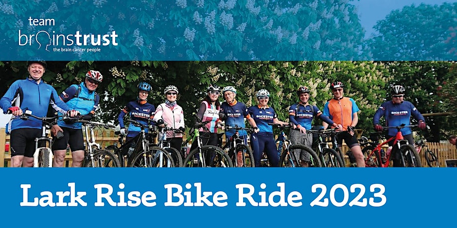 Text reads: Lark rise bike ride 2023. Image of group of cyclists smiling at the camera whilst holding their bikes.